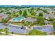 Aerial view of a community with a clubhouse, pool, and lush landscaping at 4412 Sw 49Th Ave, Ocala, FL 34474