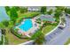 Aerial view showcasing the pool area, landscaping, and lakeside location at 4412 Sw 49Th Ave, Ocala, FL 34474