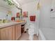 Well-lit bathroom featuring a shower-tub combo and vanity with decor at 4412 Sw 49Th Ave, Ocala, FL 34474