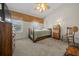 Bedroom with neutral tones, featuring a ceiling fan and natural light at 4412 Sw 49Th Ave, Ocala, FL 34474
