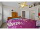 Bright bedroom featuring a large bed, neutral walls, and an ensuite bathroom at 4412 Sw 49Th Ave, Ocala, FL 34474