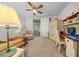 Comfortable living space with a ceiling fan, sliding glass doors to the outside, and built-in shelves at 4412 Sw 49Th Ave, Ocala, FL 34474