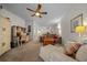 Open-concept living area featuring a ceiling fan and connected to a dining area with plenty of natural light at 4412 Sw 49Th Ave, Ocala, FL 34474