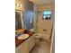 Bathroom with vanity, bathtub, shower, and updated fixtures at 5549 Nw 64Th St, Ocala, FL 34482