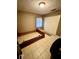 Bedroom with tile floor, closet, and window offers lots of space for functional living at 5549 Nw 64Th St, Ocala, FL 34482