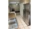 Kitchen with stainless steel appliances, granite countertops, and tile flooring at 5549 Nw 64Th St, Ocala, FL 34482