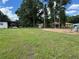 Large backyard featuring mature trees, providing privacy and shade for outdoor enjoyment and gatherings at 5787 Nw 58Th Ter, Ocala, FL 34482
