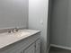Bathroom features a stylish vanity with a white countertop, offering ample space for toiletries and accessories at 5787 Nw 58Th Ter, Ocala, FL 34482