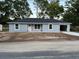 Charming single-story home featuring a new roof, light grey paint and an attached garage at 5787 Nw 58Th Ter, Ocala, FL 34482