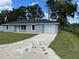 Charming single-story home with a well-maintained lawn and a one-car garage, all in a peaceful neighborhood at 5787 Nw 58Th Ter, Ocala, FL 34482