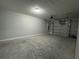 Spacious two car garage features concrete flooring and an automatic door opener at 5787 Nw 58Th Ter, Ocala, FL 34482