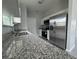 Modern kitchen featuring granite countertops and stainless steel appliances at 5787 Nw 58Th Ter, Ocala, FL 34482