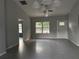 Open-concept living room features neutral paint, recessed lighting, and tile flooring at 5787 Nw 58Th Ter, Ocala, FL 34482