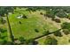 Sprawling estate featuring lush landscaping, mature trees, and expansive green space at 601 Se 80Th St, Ocala, FL 34480
