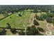 Lush acreage featuring mature trees, expansive green space, and landscaped borders at 601 Se 80Th St, Ocala, FL 34480