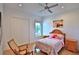 Comfortable bedroom featuring a ceiling fan, natural light, and hardwood floors at 601 Se 80Th St, Ocala, FL 34480