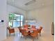 Stylish dining room with modern chandelier, large windows and comfortable seating at 601 Se 80Th St, Ocala, FL 34480