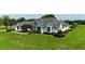 Beautiful single-story home with stucco exterior and a well-manicured lawn at 601 Se 80Th St, Ocala, FL 34480