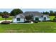 Well-maintained property boasting lush lawn and mature trees for added privacy at 601 Se 80Th St, Ocala, FL 34480