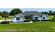 Well-maintained property boasting lush lawn and mature trees for added privacy at 601 Se 80Th St, Ocala, FL 34480