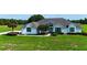 Charming home featuring manicured landscaping and mature trees on a spacious lot at 601 Se 80Th St, Ocala, FL 34480