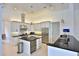Modern kitchen featuring stainless steel appliances, granite countertops, and pendant lighting at 601 Se 80Th St, Ocala, FL 34480
