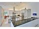 A spacious, modern kitchen with stainless steel appliances, granite countertops, and ample storage at 601 Se 80Th St, Ocala, FL 34480