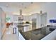 Modern kitchen with stainless steel appliances, granite countertops, and ample cabinet space at 601 Se 80Th St, Ocala, FL 34480