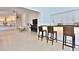 Spacious living room features modern chairs, fireplace, and wet bar with barstool seating at 601 Se 80Th St, Ocala, FL 34480
