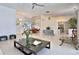 An open-concept living room and dining space with modern decor and plenty of natural light at 601 Se 80Th St, Ocala, FL 34480