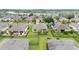 Elevated view of homes with solar panels, screened enclosures, and meticulously maintained lawns at 6651 Sw 93Rd Ct, Ocala, FL 34481