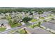 Aerial view of a residential neighborhood featuring well-maintained lawns and mature trees at 6651 Sw 93Rd Ct, Ocala, FL 34481