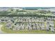 Panoramic aerial perspective of a suburban area with consistent architectural themes and verdant landscaping at 6651 Sw 93Rd Ct, Ocala, FL 34481