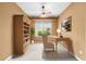 Well staged bedroom with desk, bookcase and view from the window at 6651 Sw 93Rd Ct, Ocala, FL 34481