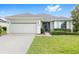 Charming one-story home with well-manicured lawn and a two-car garage at 6651 Sw 93Rd Ct, Ocala, FL 34481