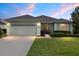 Charming one-story home with well-manicured lawn and a two-car garage at 6651 Sw 93Rd Ct, Ocala, FL 34481