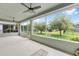 Relaxing screened lanai with scenic views of the fenced backyard at 6651 Sw 93Rd Ct, Ocala, FL 34481