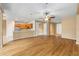 Open floor plan with wood flooring connecting living area and kitchen at 6651 Sw 93Rd Ct, Ocala, FL 34481