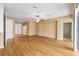 Spacious living room featuring wood flooring, ceiling fan, and natural light at 6651 Sw 93Rd Ct, Ocala, FL 34481