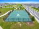 Aerial view of the community basketball court surrounded by fences and neighborhood homes at 7641 Sw 63Rd Lane Road, Ocala, FL 34474