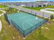Aerial view of the community basketball court surrounded by a fence and grassy areas at 7641 Sw 63Rd Lane Road, Ocala, FL 34474