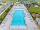 Beautiful community pool featuring a spacious deck with lounge chairs for relaxation and soaking up the sun at 7641 Sw 63Rd Lane Road, Ocala, FL 34474