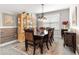 Formal dining room with elegant wood table, hutch, and decorative furnishings at 7641 Sw 63Rd Lane Road, Ocala, FL 34474