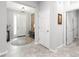 Bright foyer with tiled floors, complemented by white trim and a decorative rug creating an inviting entrance at 7641 Sw 63Rd Lane Road, Ocala, FL 34474
