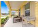 Relaxing front porch with comfortable seating, offering a peaceful spot to enjoy the neighborhood view at 7641 Sw 63Rd Lane Road, Ocala, FL 34474