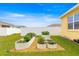 Backyard garden with metal raised garden beds, plants, and gravel at 7641 Sw 63Rd Lane Road, Ocala, FL 34474