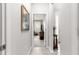 Hallway with neutral walls leading to a bright living area at 7641 Sw 63Rd Lane Road, Ocala, FL 34474
