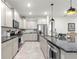 Modern kitchen with stainless steel appliances, granite counters, and a large island perfect for cooking at 7641 Sw 63Rd Lane Road, Ocala, FL 34474