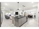 Kitchen with granite island open to dining and living spaces creates seamless flow, perfect for entertaining at 7641 Sw 63Rd Lane Road, Ocala, FL 34474