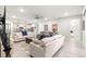 Bright living room with seamless flow into kitchen, creating an open and airy space for living and entertaining at 7641 Sw 63Rd Lane Road, Ocala, FL 34474